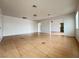 Open living room with hardwood flooring, modern ceiling and neutral paint at 524 Bedford Rd, Las Vegas, NV 89107