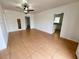 Spacious living room with tiled flooring, ceiling fan and fresh paint at 524 Bedford Rd, Las Vegas, NV 89107