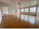 Open living room with hardwood flooring, modern ceiling and neutral paint at 524 Bedford Rd, Las Vegas, NV 89107