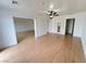 Spacious living room with tiled flooring, ceiling fan and fresh paint at 524 Bedford Rd, Las Vegas, NV 89107