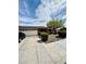 Well-maintained home featuring a two-car garage, solar panels and manicured landscaping with cloudy skies at 5268 Caspian Dr, Las Vegas, NV 89118
