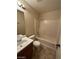 Bright bathroom with a white shower-tub combination and a single sink vanity at 5433 Bridgehampton Ave, Las Vegas, NV 89130