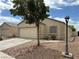 Single-story home with a well-maintained front yard, desert landscaping and a two car garage at 5433 Bridgehampton Ave, Las Vegas, NV 89130
