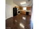 Efficient kitchen with a gas range, wood cabinets, and updated appliances at 5433 Bridgehampton Ave, Las Vegas, NV 89130