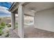 Outdoor living area featuring a covered porch, brick flooring, and views of the pool and surrounding landscape at 6 Lilla Rosa St, Henderson, NV 89011