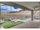 Inviting outdoor oasis with a refreshing pool, well-manicured landscaping, and lounge seating at 6 Lilla Rosa St, Henderson, NV 89011