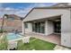 Inviting patio area with a pool, sliding glass doors, and well-manicured greenery at 6 Lilla Rosa St, Henderson, NV 89011