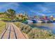 Waterfront property showcasing bridges and waterfront property with colorful architecture and lush greenery at 6 Lilla Rosa St, Henderson, NV 89011