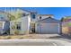 Charming two-story home with a well-maintained front yard and a two-car garage at 6 Lilla Rosa St, Henderson, NV 89011