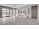 Spacious living room featuring a ceiling fan, tile floors, and sliding glass doors to the outdoor pool area at 6 Lilla Rosa St, Henderson, NV 89011