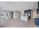 Spacious open-concept living space with modern kitchen, tile floors, and recessed lighting at 6 Lilla Rosa St, Henderson, NV 89011