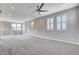 Sunlit loft with large windows and a ceiling fan, perfect for relaxing or entertaining guests at 6 Lilla Rosa St, Henderson, NV 89011