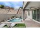 Backyard oasis with a pool and spa combination, perfect for relaxation and entertainment at 6 Lilla Rosa St, Henderson, NV 89011