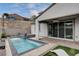 Outdoor patio area with a pool and spa combo and a relaxing space for gatherings at 6 Lilla Rosa St, Henderson, NV 89011