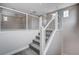 Modern staircase with carpeted steps, white risers, steel railing and view of upper level living area at 6 Lilla Rosa St, Henderson, NV 89011