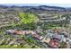 A scenic aerial view featuring luxury homes nestled in a golf course community against a mountain backdrop at 6 Rue Du Ville Way, Henderson, NV 89011