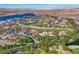 Panoramic aerial view of a residential area with a golf course and lake, offering scenic beauty at 6 Rue Du Ville Way, Henderson, NV 89011