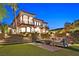 Outdoor living space with fire pit, lounge furniture, and a staircase leading to the home at 6 Rue Du Ville Way, Henderson, NV 89011