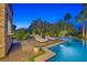 Lounge by this pool with fire feature and bar; backyard offers privacy and relaxation at 6 Rue Du Ville Way, Henderson, NV 89011