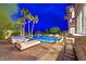 Enjoy the luxurious backyard featuring a sparkling pool, comfortable lounge chairs, and an outdoor bar at 6 Rue Du Ville Way, Henderson, NV 89011