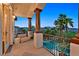 Balcony with comfortable seating, and a beautiful pool and mountain view at 6 Rue Du Ville Way, Henderson, NV 89011