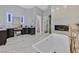 Bright bathroom with modern tub, fireplace, double vanity, and marble floors creates a spa-like retreat at 6 Rue Du Ville Way, Henderson, NV 89011