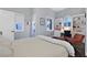 Bright bedroom with a built-in desk area, plush carpeting, and multiple windows for natural light and air at 6 Rue Du Ville Way, Henderson, NV 89011