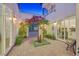 Charming courtyard with decorative foliage, stone accents, and stylish lighting at 6 Rue Du Ville Way, Henderson, NV 89011
