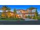 Stunning two-story home featuring a tile roof, arched entry, and meticulous landscaping at 6 Rue Du Ville Way, Henderson, NV 89011
