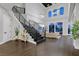 Open living space with large windows and modern staircase at 6 Rue Du Ville Way, Henderson, NV 89011