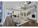 Spacious living room with an adjacent kitchen and grand staircase at 6 Rue Du Ville Way, Henderson, NV 89011