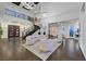 Bright, airy living room with high ceilings, statement lighting, and unique staircase at 6 Rue Du Ville Way, Henderson, NV 89011