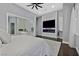 Bedroom featuring a large television and an open en-suite bathroom at 6 Rue Du Ville Way, Henderson, NV 89011