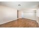 A bedroom featuring an open closet, wood-look floors, and one window at 620 Macbrey Dr, Las Vegas, NV 89123