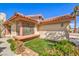 Close-up of a well-maintained home featuring a window box and desert landscaping at 620 Macbrey Dr, Las Vegas, NV 89123