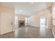 Bright living room with stone fireplace, tiled flooring, and modern recessed lighting at 620 Macbrey Dr, Las Vegas, NV 89123
