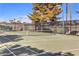 Well-maintained community tennis court with net, benches, and manicured landscaping at 620 Macbrey Dr, Las Vegas, NV 89123