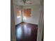 Bedroom showcasing hardwood floors and window with blinds that provide natural light at 6476 Ness Gardens Ct, Las Vegas, NV 89122