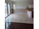 Open dining area with tile floors, sliding glass door, and adjacent to the kitchen island with granite countertops at 6476 Ness Gardens Ct, Las Vegas, NV 89122