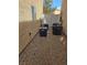 Exterior side yard with multiple air conditioning units with gravel covering at 6476 Ness Gardens Ct, Las Vegas, NV 89122