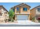 Charming two-story home featuring a two-car garage and low maintenance desert landscaping at 6476 Ness Gardens Ct, Las Vegas, NV 89122