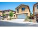 Inviting two-story home with a well-manicured front yard and desert landscaping at 6476 Ness Gardens Ct, Las Vegas, NV 89122