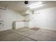 Spacious garage with built-in cabinets, white walls, and ample storage space at 6476 Ness Gardens Ct, Las Vegas, NV 89122