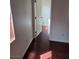 Hallway leading to a bedroom with an open closet view at 6476 Ness Gardens Ct, Las Vegas, NV 89122