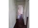 Hallway featuring hardwood floors that lead to the bedroom at 6476 Ness Gardens Ct, Las Vegas, NV 89122