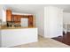 Open kitchen with dark cabinetry, granite countertops, and stainless steel sink at 6476 Ness Gardens Ct, Las Vegas, NV 89122