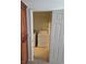 Practical laundry area featuring a washer, dryer, and storage shelving at 6476 Ness Gardens Ct, Las Vegas, NV 89122