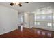 Upstairs living room features wood floors and staircase access at 6476 Ness Gardens Ct, Las Vegas, NV 89122
