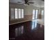 Spacious living room boasting hardwood floors, and abundant natural light at 6476 Ness Gardens Ct, Las Vegas, NV 89122