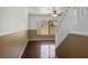 Bright living room with hardwood floors, chair rail, ceiling fan and shuttered window at 6476 Ness Gardens Ct, Las Vegas, NV 89122